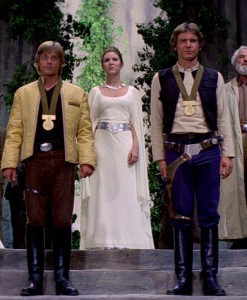 Luke, Leia, and Han at the award ceremony after the Battle of Yavin.
